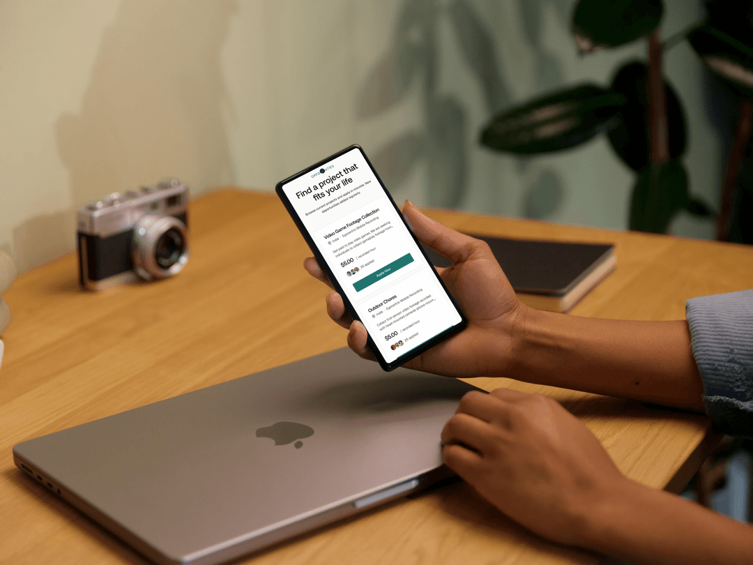 Hand holding phone showing Visora app
